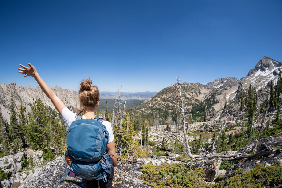Female hiker with backpack along the Sawtooth Lake trail in Idaho
