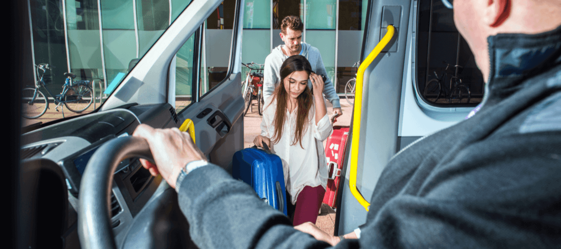 two people hopping on an airport shuttle