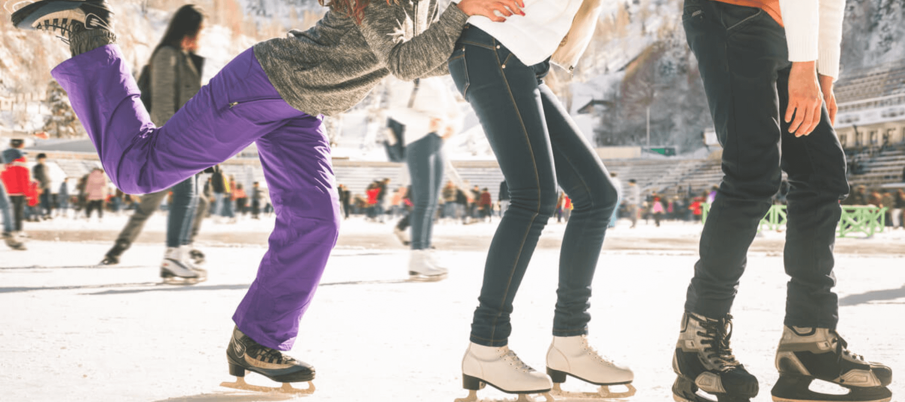 group of ice skaters at an ice rink