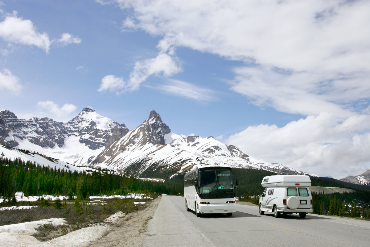 charter bus traveling to mountain destination