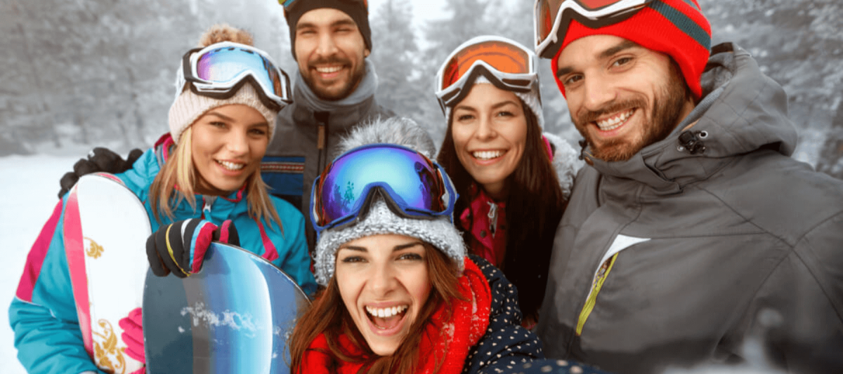 happy group of friends skiing