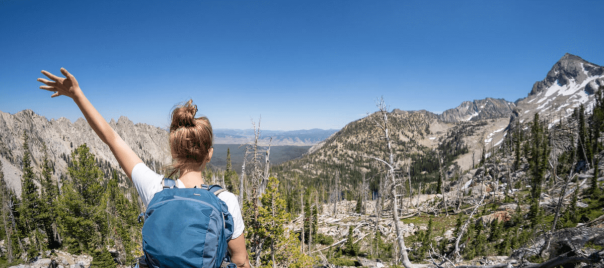 woman hiker overlooking mountain range