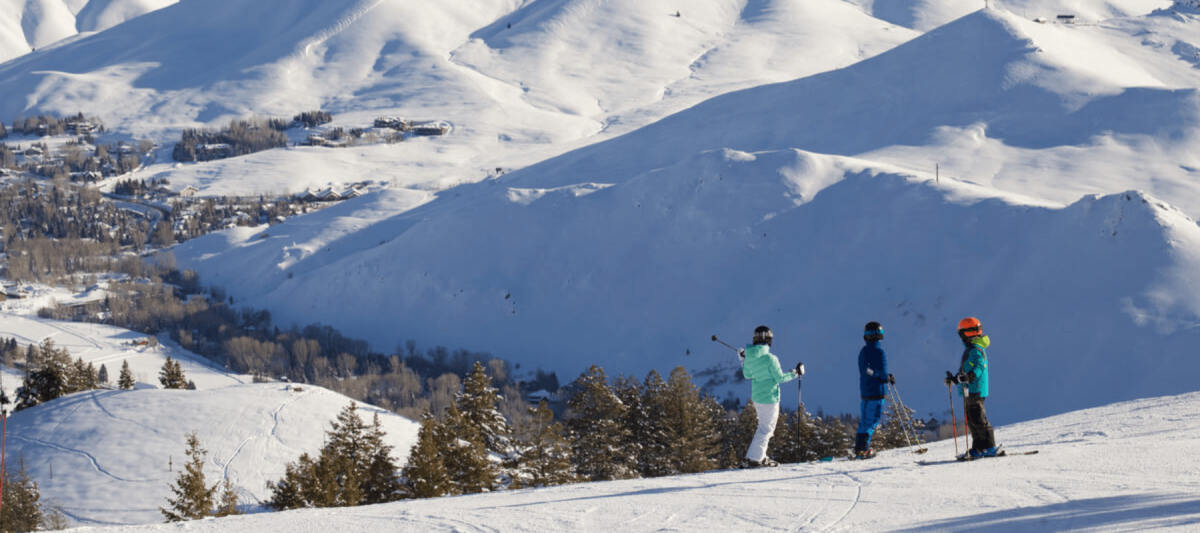 skiers on top of the mountain